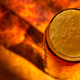Pint of beer on a copper bar, with shadow, shot from above